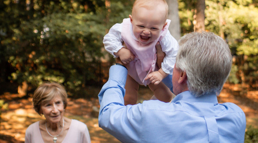 Alternate Grandparent Name Blog Photo of Grandpa with baby and Grandma watching