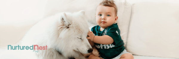 Mom and toddler teaching dog to sit in backyard