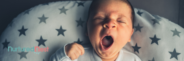 Mom holding baby contact nap