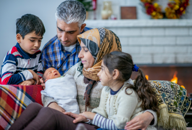 Family cherishing newborn, highlighting important newborn screening tests before hospital discharge.