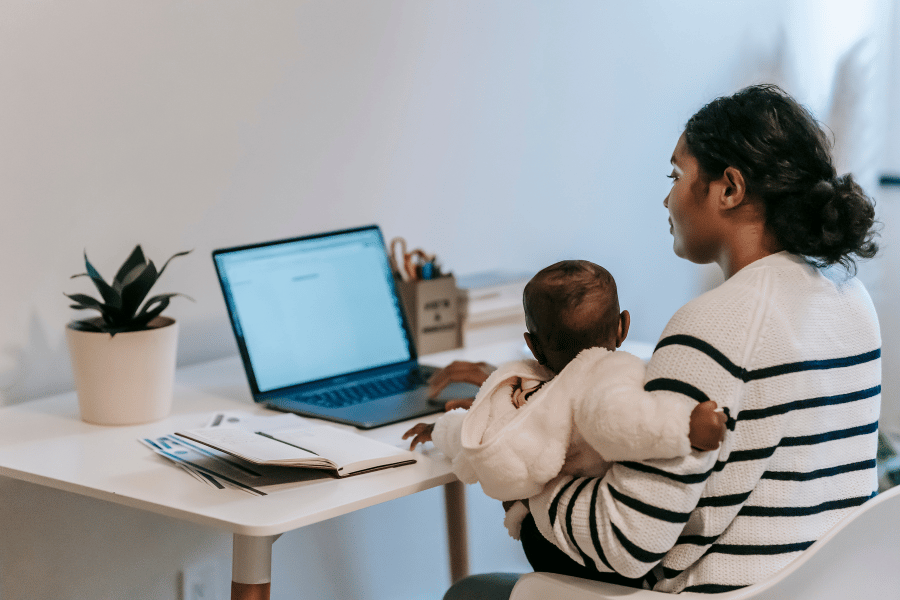 Parent watching online infant care class on computer