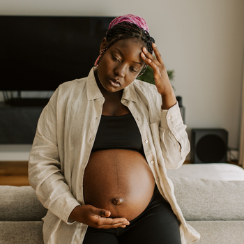 Expecting couple reading a book and learning about childbirth
